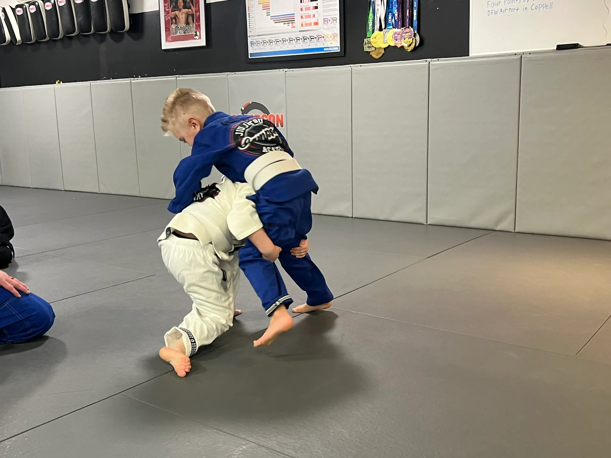 Kids Brazilian Jiu Jitsu gear laid out at Sampson Jiu Jitsu Academy in Southlake