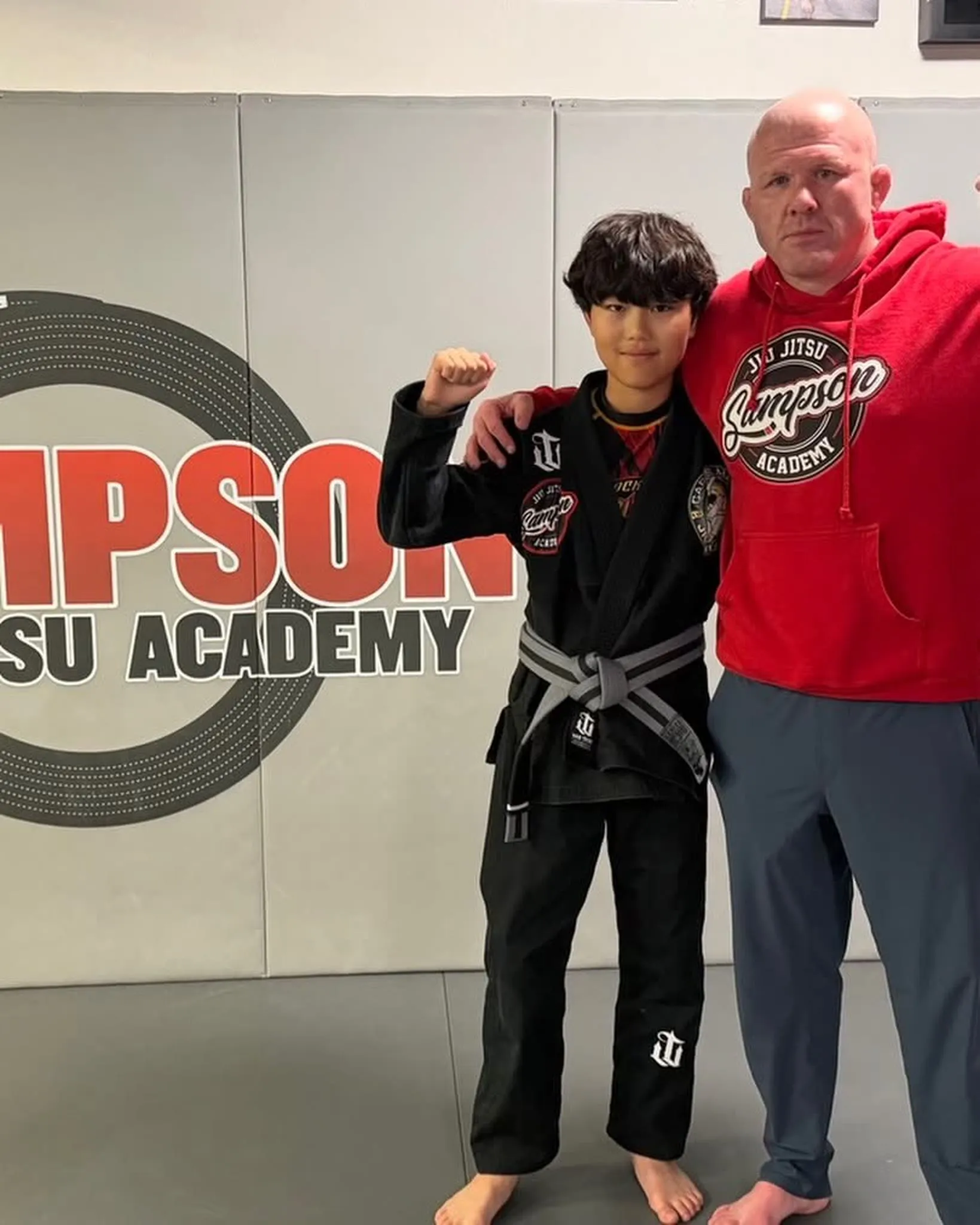 Young Brazilian Jiu Jitsu student in a blue gi at Sampson Jiu Jitsu Academy in Southlake