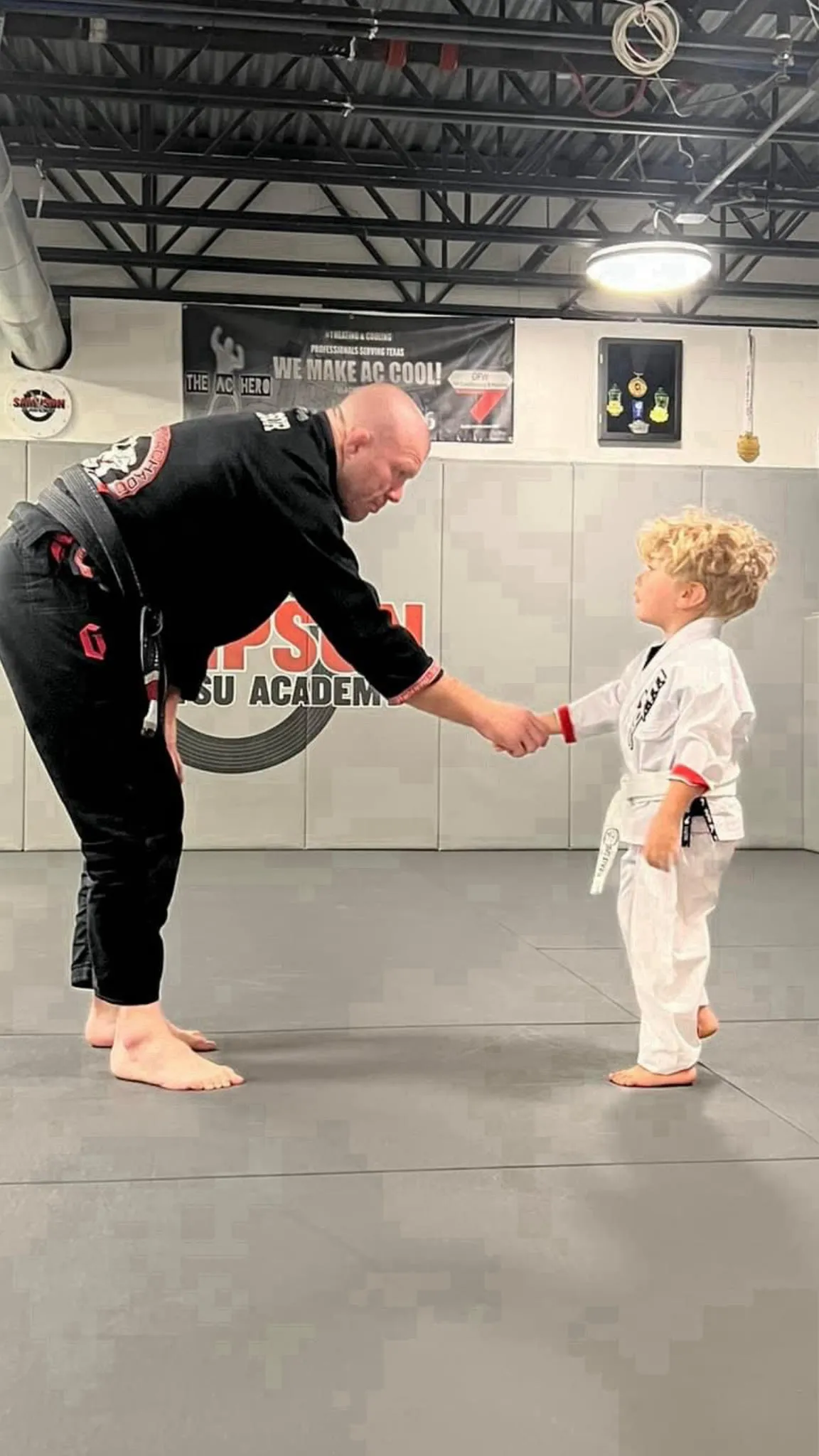 New student being welcomed at the front desk at Sampson Jiu Jitsu Academy in Southlake